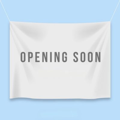 Image of a fabric banner wtih "coming soon" printed on it