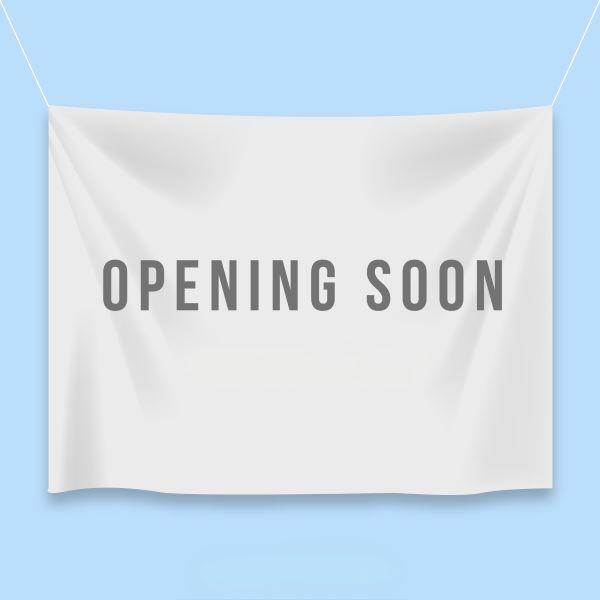 Image of a fabric banner wtih "coming soon" printed on it