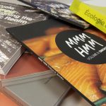 Image of multiple perfect bound books.