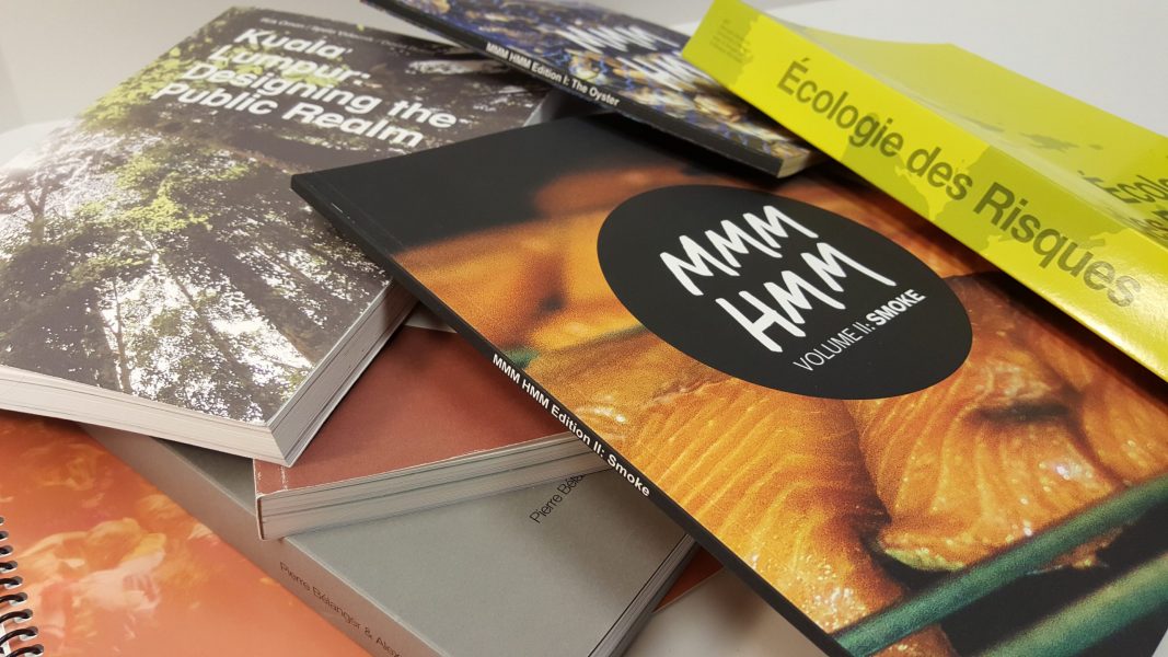 Image of multiple perfect bound books.